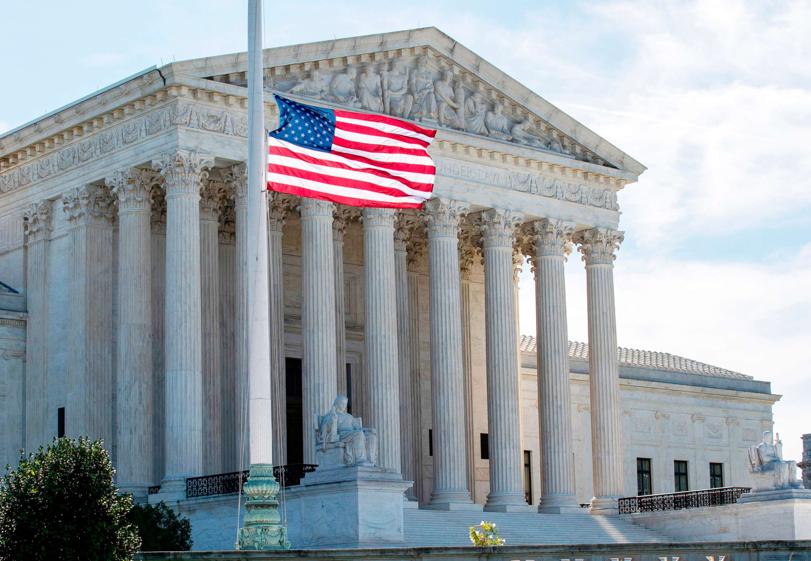 PHOTO: The US flag flies at half-staff outside of the Supreme Court in memory of Associate Justice Ruth Bader Ginsburg, in Washington on Sept. 19, 2020.