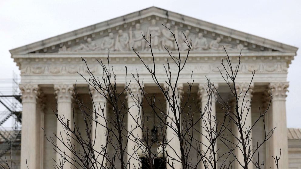PHOTO: Branches slightly obscure the facade of the U.S. Supreme Court building April 07, 2023 in Washington, DC.