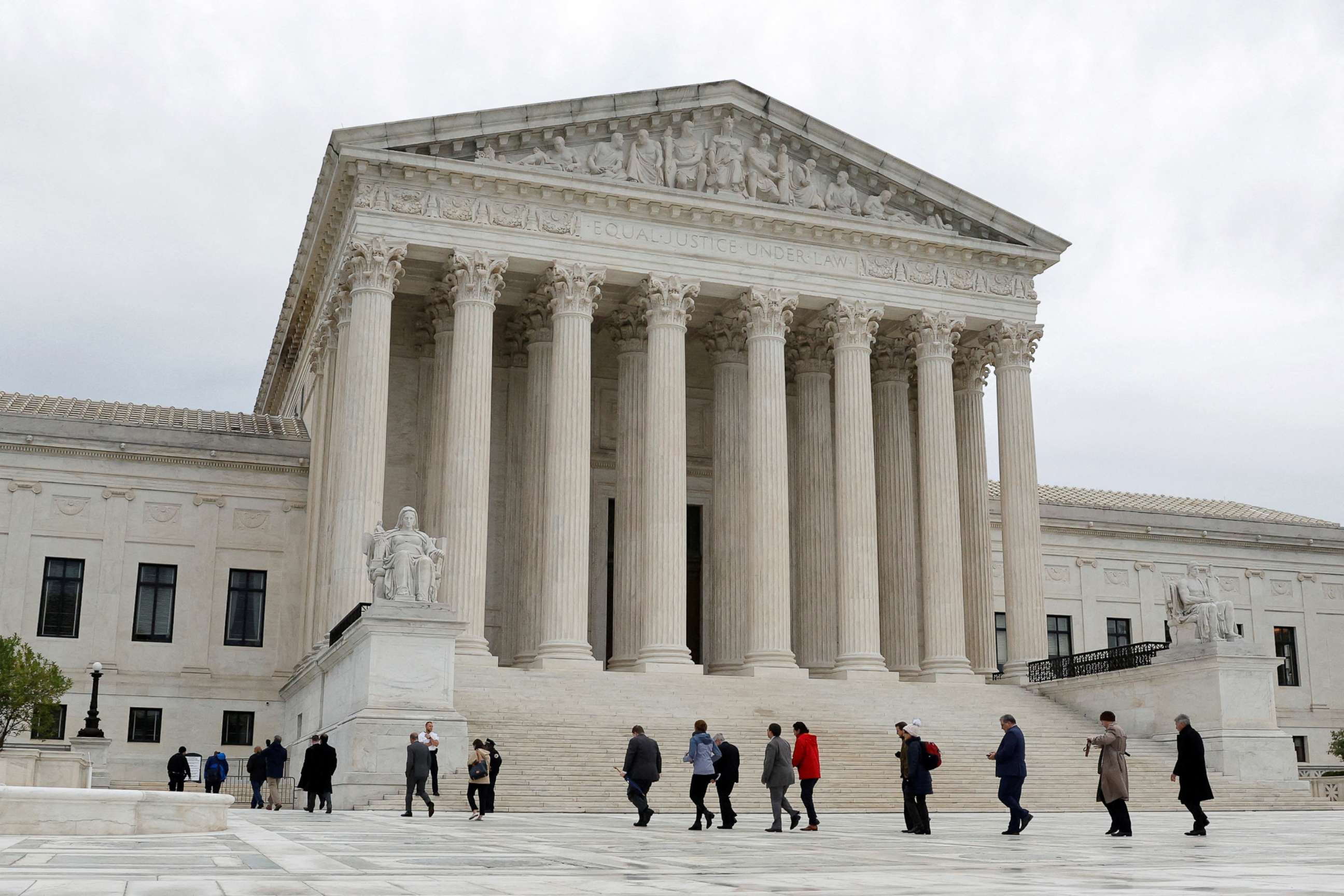 PHOTO: People walk across the plaza of the U.S. Supreme Court building on the first day of the court's new term in Washington, D.C., Oct. 3, 2022. 