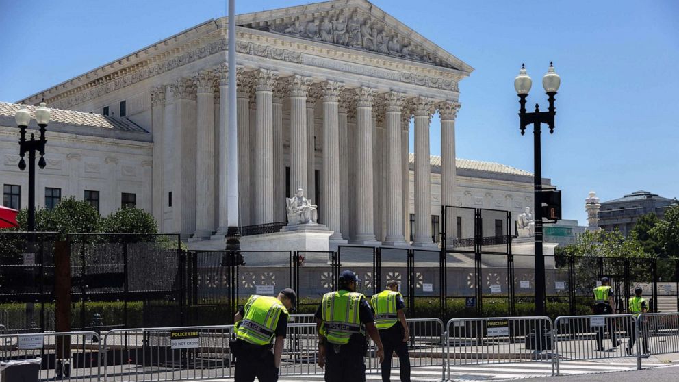 PHOTO: U.S. Capitol Police patrol outside of the Supreme Court as demonstrators march around Senate Office buildings in Washington, D.C., on June 29, 2022.