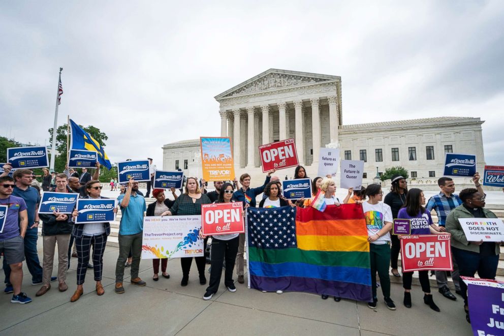 PHOTO: Supporters of the American Civil Liberties Union and other progressive groups gather to protest the Supreme Court decision to side with a Colorado baker who refused to bake a cake for a same sex couple in Colorado in Washington, DC, June 4, 2018.