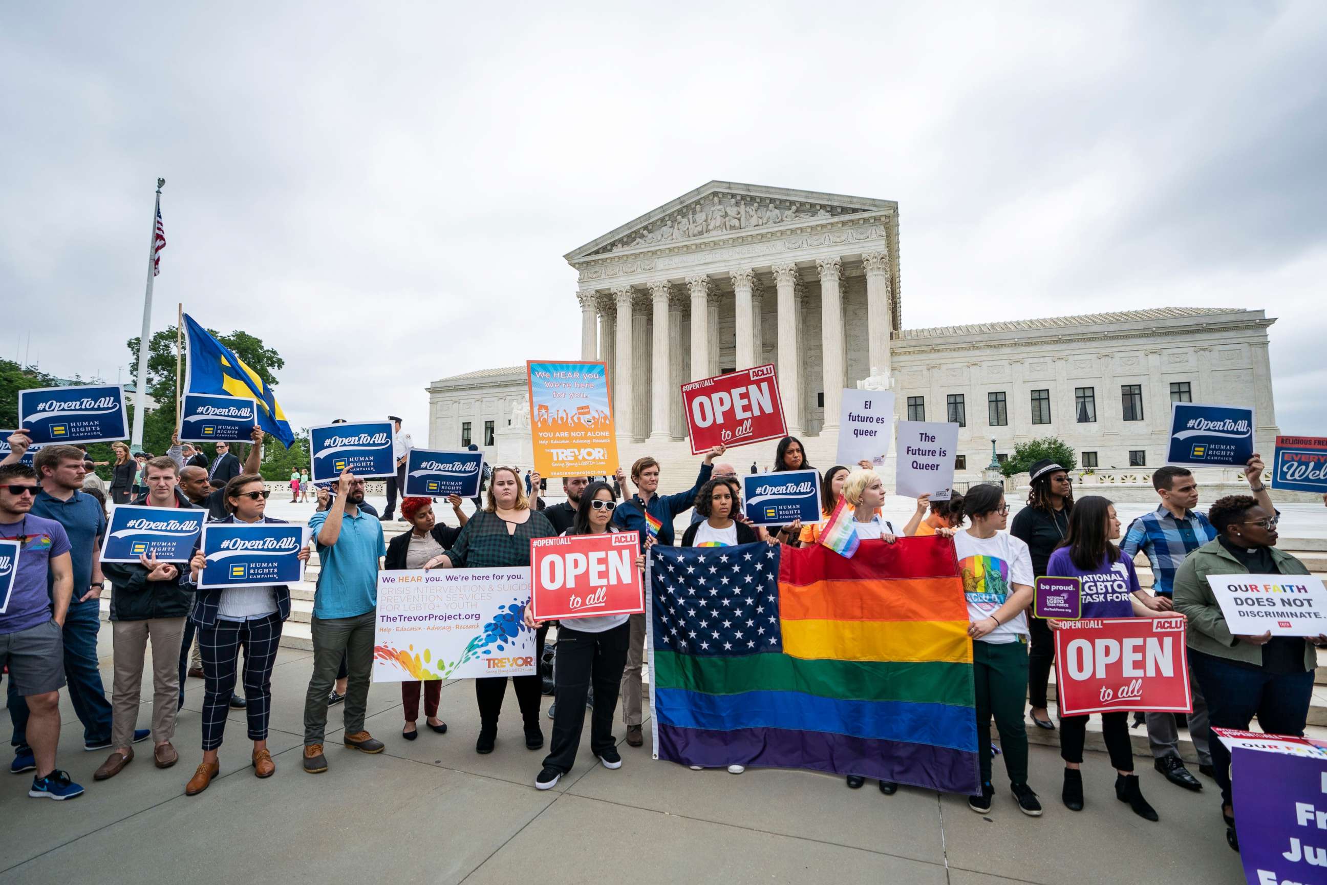 PHOTO: Supporters of the American Civil Liberties Union and other progressive groups gather to protest the Supreme Court decision to side with a Colorado baker who refused to bake a cake for a same sex couple in Colorado in Washington, DC, June 4, 2018.