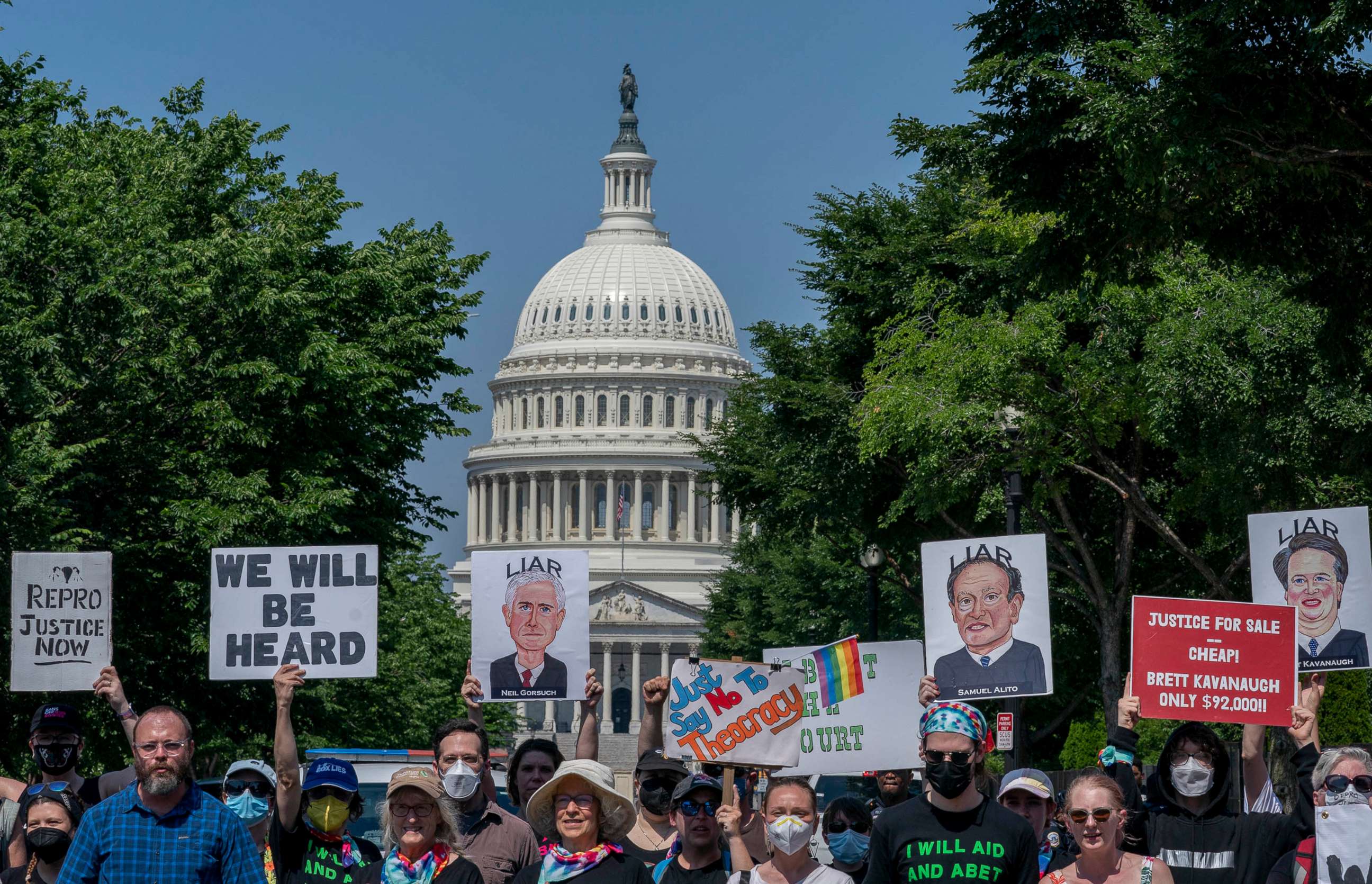 PHOTO: Abortion-rights protesters display images of Supreme Court Justices Neil Gorsuch, Samuel Alito, and Brett Kavanaugh during a demonstration outside the U.S. Supreme Court in Washington, June 13, 2022.