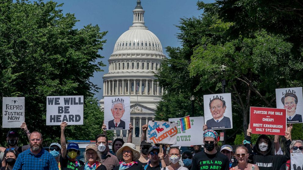 PHOTO: Abortion-rights protesters display images of Supreme Court Justices Neil Gorsuch, Samuel Alito, and Brett Kavanaugh during a demonstration outside the U.S. Supreme Court in Washington, June 13, 2022.