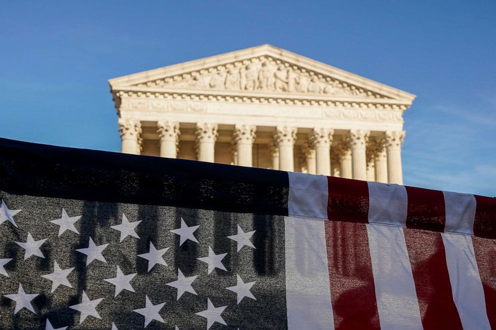 PHOTO: A U.S. flag is seen during a demonstration before a vote on the nomination of Amy Coney Barrett to the Supreme Court in Washington, D.C., on Oct. 26, 2020.
