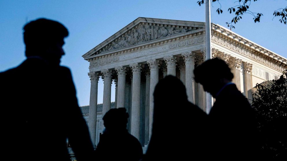 PHOTO: People wait in line outside the U.S. Supreme Court in Washington, D.C., on Oc.11, 2022.