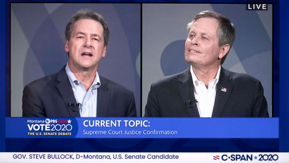 PHOTO: Montana Governor Steve Bullock speaks to incumbent Sen. Steve Daines during a PBS broadcast of the Senate debate in Missoula, Mont., Sept. 28, 2020.