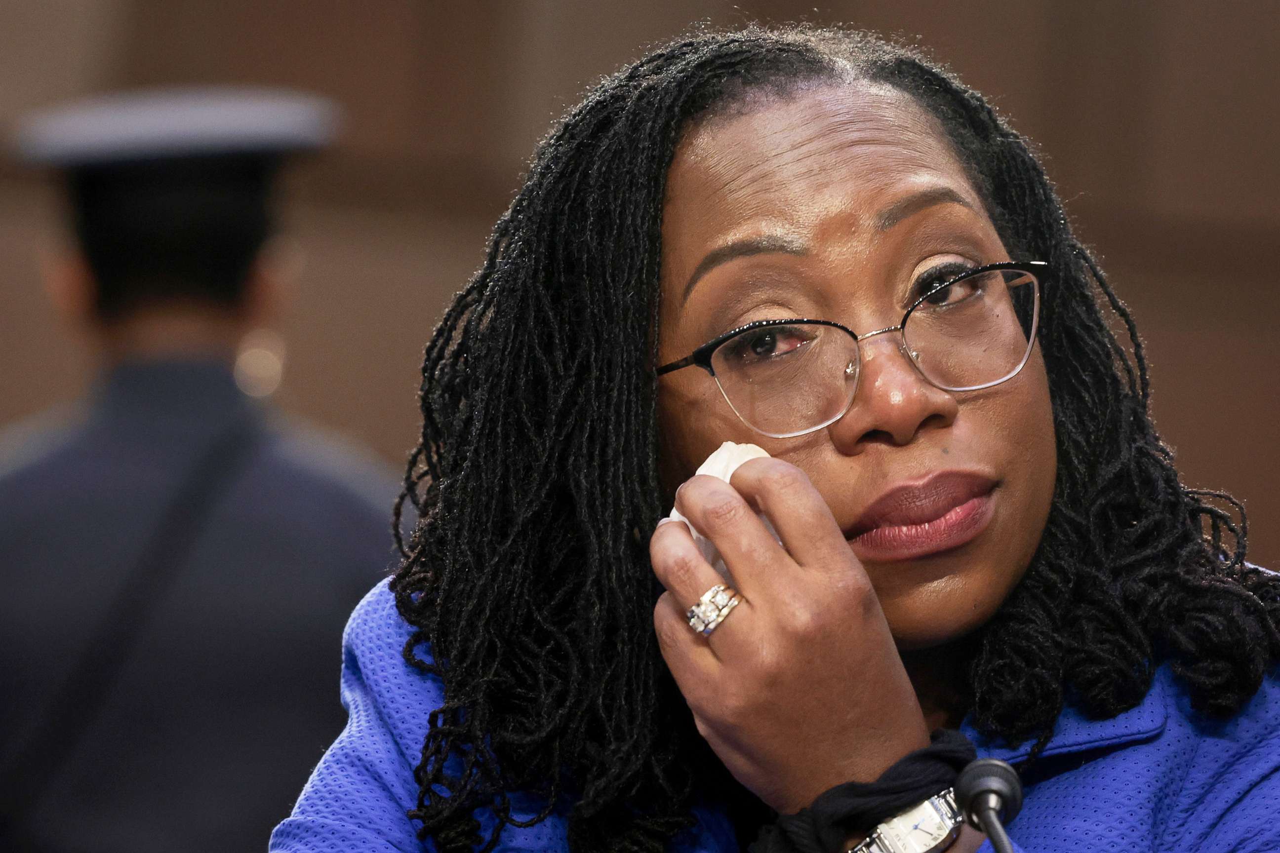 PHOTO: While listening to Sen. Cory Booker speak, Supreme Court nominee Judge Ketanji Brown Jackson wipes away tears during her confirmation hearing before the Senate Judiciary Committee in the Hart Senate Office Building on Capitol Hill, March 23, 2022.