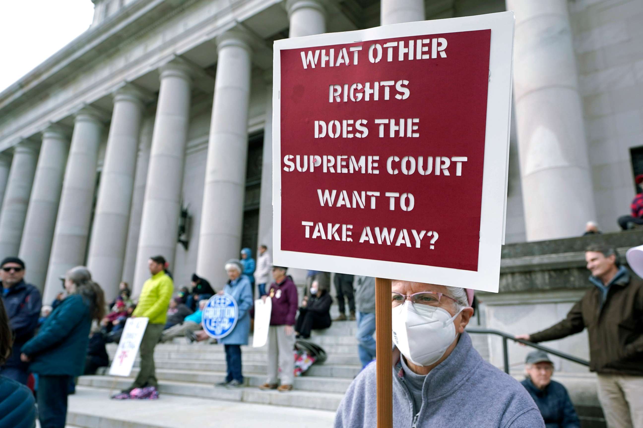 PHOTO: A person holds a sign referencing the U.S. Supreme Court as they take part in a rally in favor of abortion rights on the steps of the Temple of Justice, which houses the Washington state Supreme Court at the Capitol in Olympia, Wash.,  May 3, 2022.