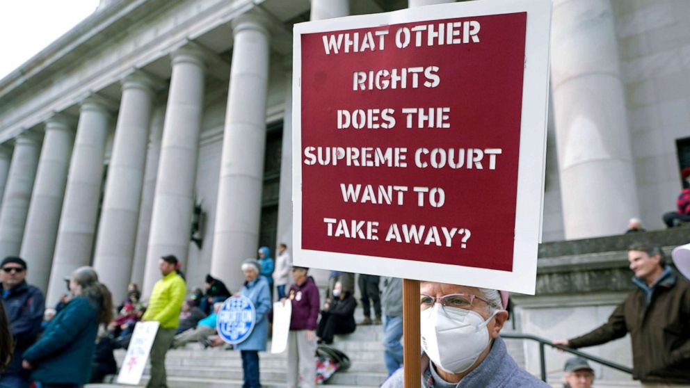PHOTO: A person holds a sign referencing the U.S. Supreme Court as they take part in a rally in favor of abortion rights on the steps of the Temple of Justice, which houses the Washington state Supreme Court at the Capitol in Olympia, Wash.,  May 3, 2022.
