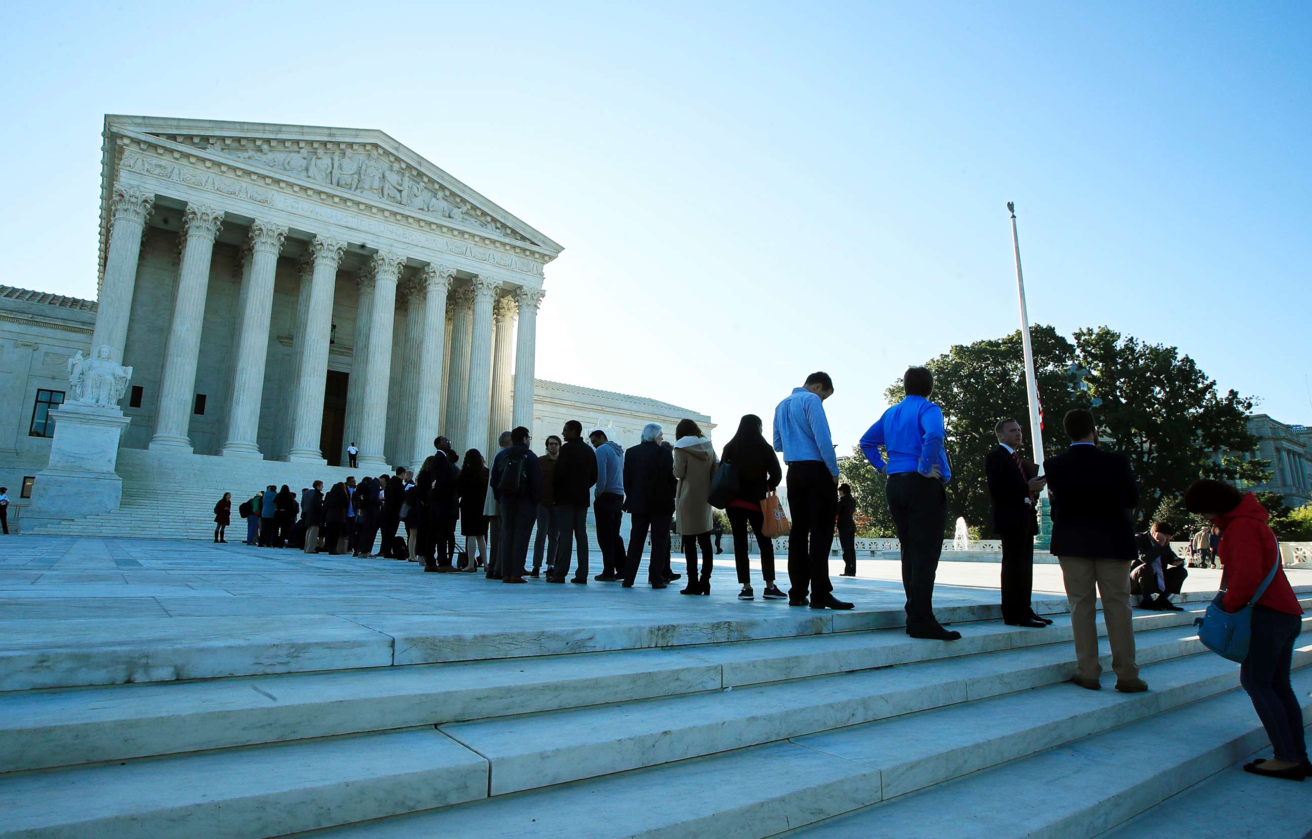 PHOTO: People line up outside the U.S. Supreme Court in Washington to hear arguments in a case about political maps in Wisconsin that could affect elections across the country, Oct. 3, 2017.