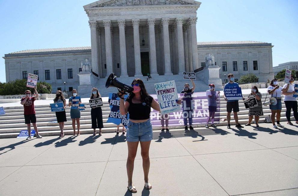 PHOTO: People in front of the Supreme Court in Washington, D.C., on June 29, 2020.