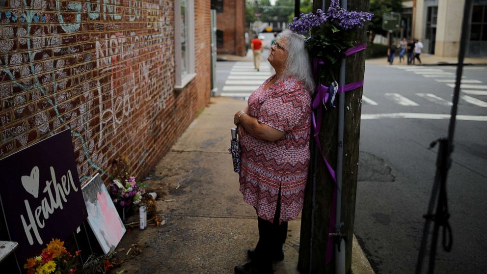 PHOTO: Susan Bro, mother of Heather Heyer, who was killed during the August 2017 white nationalist rally in Charlottesville, stands at the memorial at the site where her daughter was struck by a car in Charlottesville, Va., July 31, 2018.