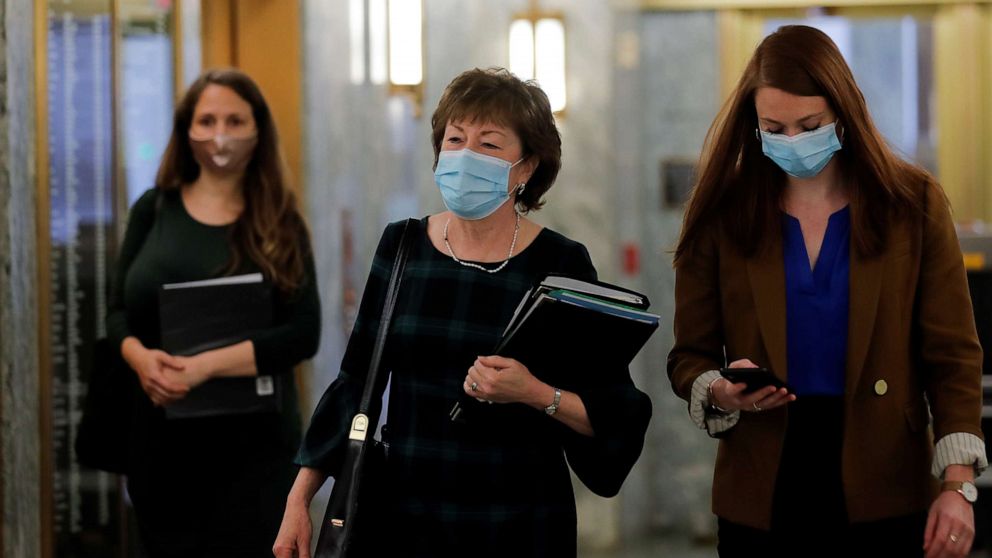 PHOTO: Senator Susan Collins and members of her staff wear protective face masks as they arrive prior to a Senate Health Education Labor and Pensions Committee hearing on Capitol Hill in Washington, May 12, 2020.