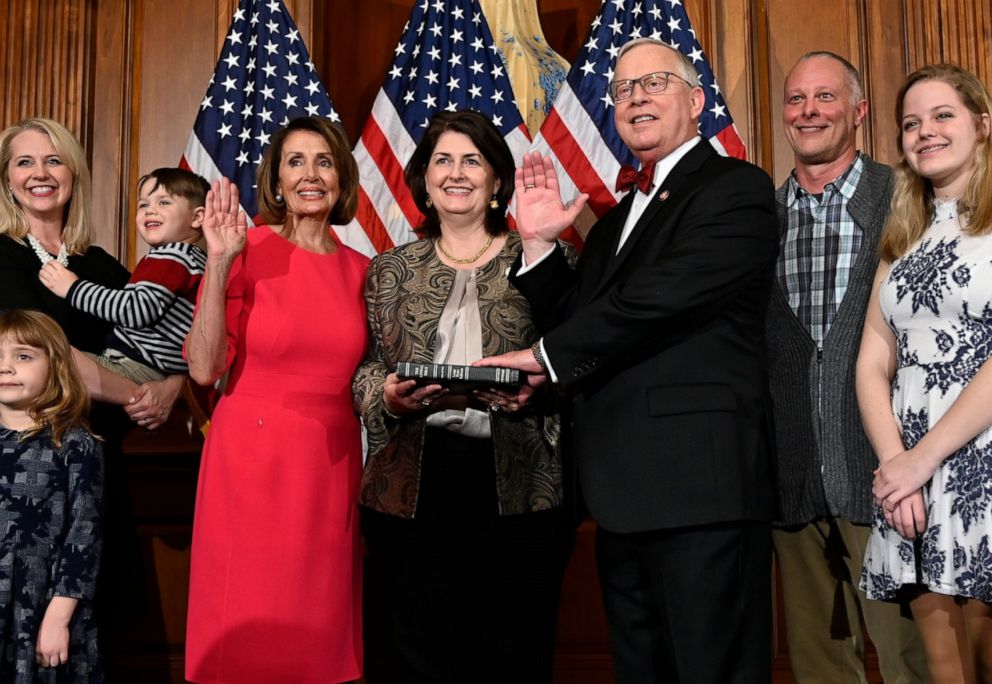 PHOTO: In this Jan. 3, 2019 file photo, Susan Wright, center, holds the Bible for her husband Ron's swearing in to the 116th Congress. Ron Wright died on Feb. 8, 2021, two weeks after being diagnosed with COVID-19. His wife is now running for his seat.