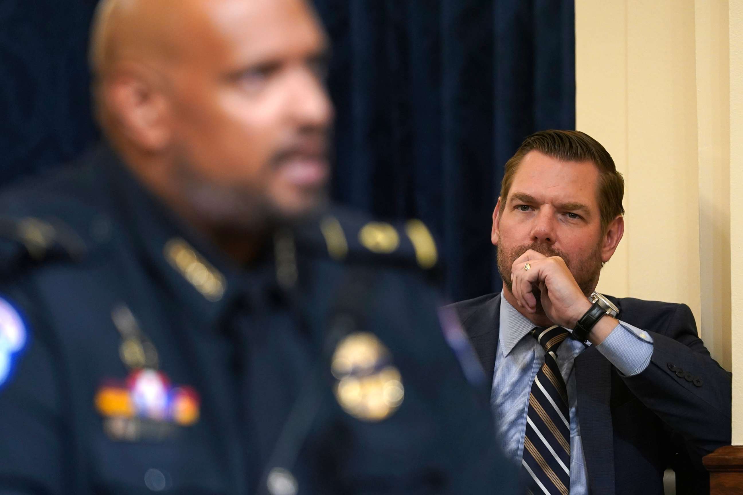 PHOTO: Rep. Eric Swalwell, D-Calif., stands on the side and listens as U.S. Capitol Police Sgt. Harry Dunn testifies during the House select committee hearing on the Jan. 6 attack on Capitol Hill in Washington, Tuesday, July 27, 2021. 