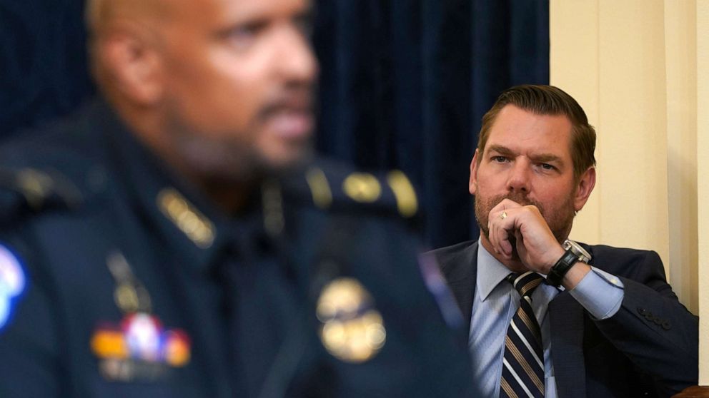 PHOTO: Rep. Eric Swalwell, D-Calif., stands on the side and listens as U.S. Capitol Police Sgt. Harry Dunn testifies during the House select committee hearing on the Jan. 6 attack on Capitol Hill in Washington, Tuesday, July 27, 2021. 