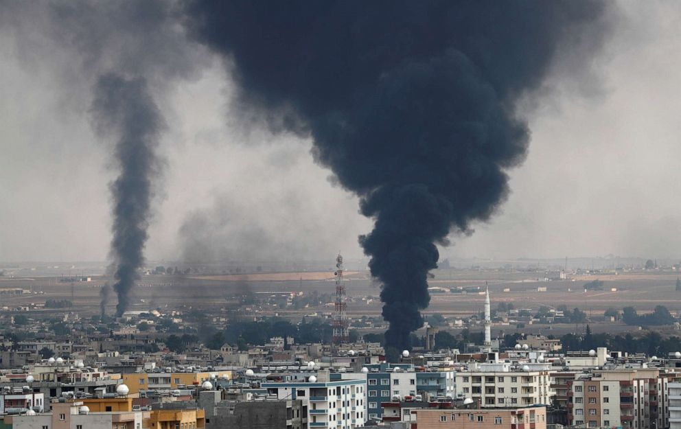 PHOTO: Smoke rises over the Syrian town of Ras al Ain, as seen from the Turkish border town of Ceylanpinar, in Sanliurfa province, Turkey, October 16, 2019.