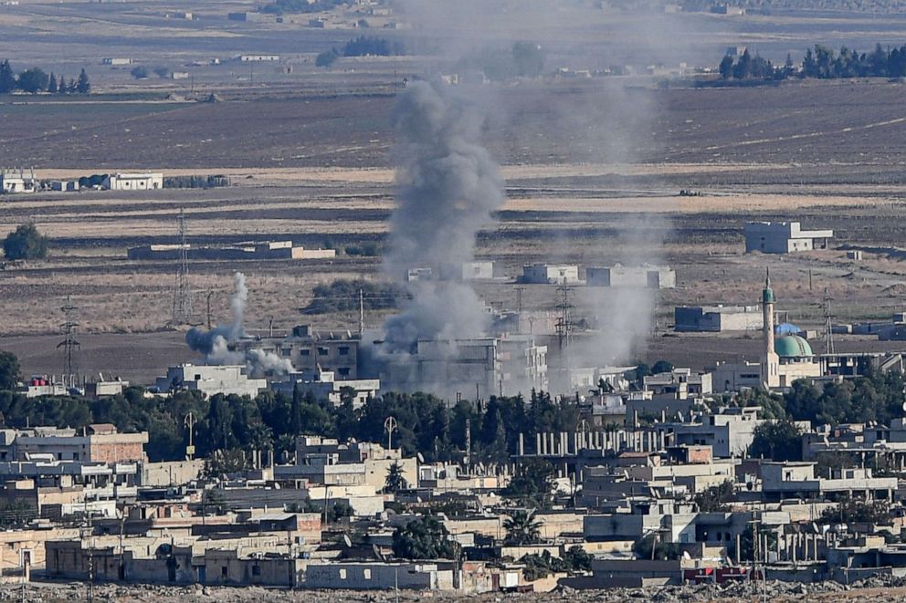 PHOTO: Smoke rises from the Syrian town of Ras al-Ain on the first week of Turkey's military operation against Kurdish forces, Oct. 15, 2019. 