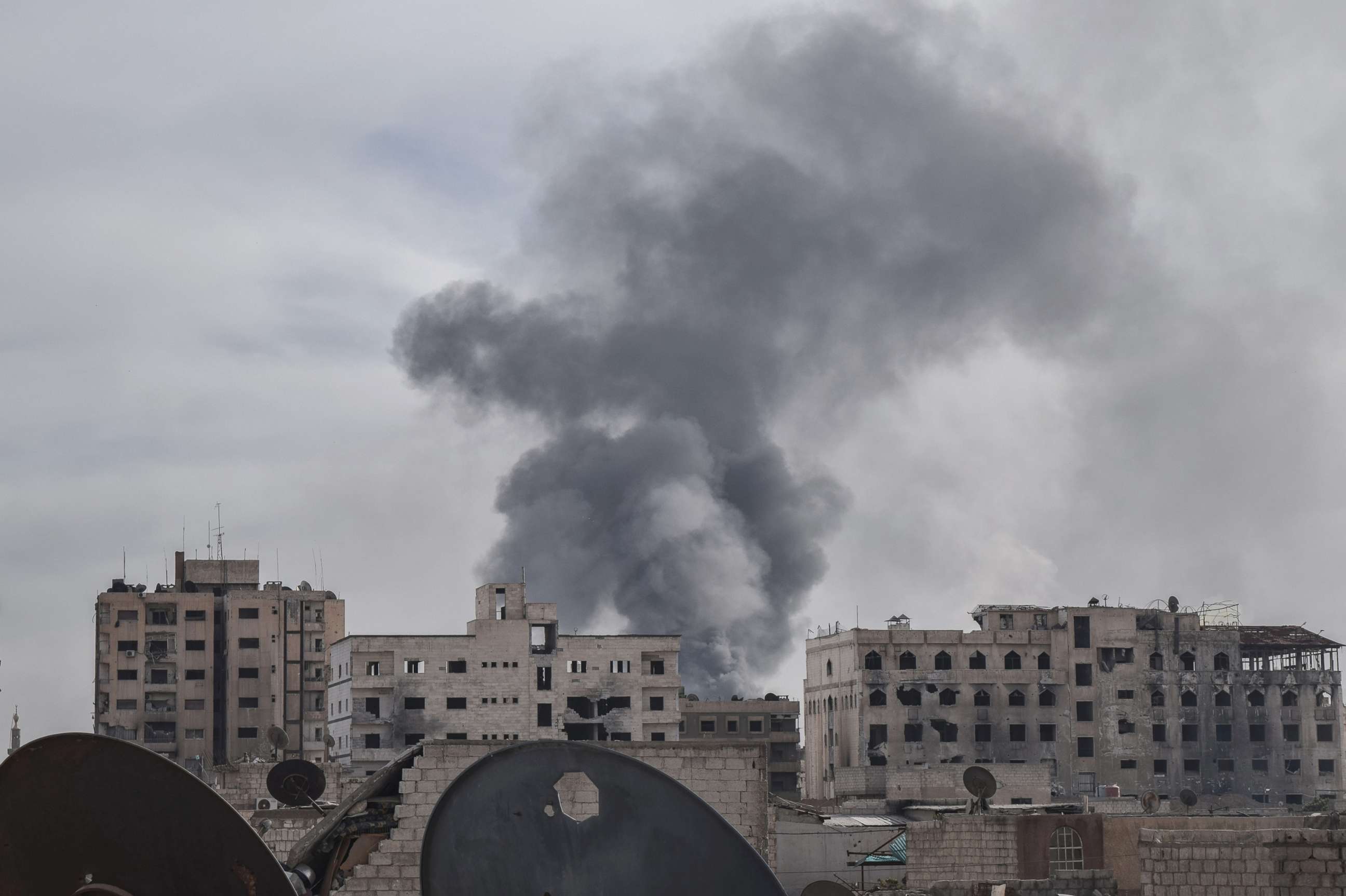 PHOTO: Smoke rises after Assad Regime carried out an airstrike at Duma town of Eastern Ghouta in Damascus, Syria, April 7, 2018.