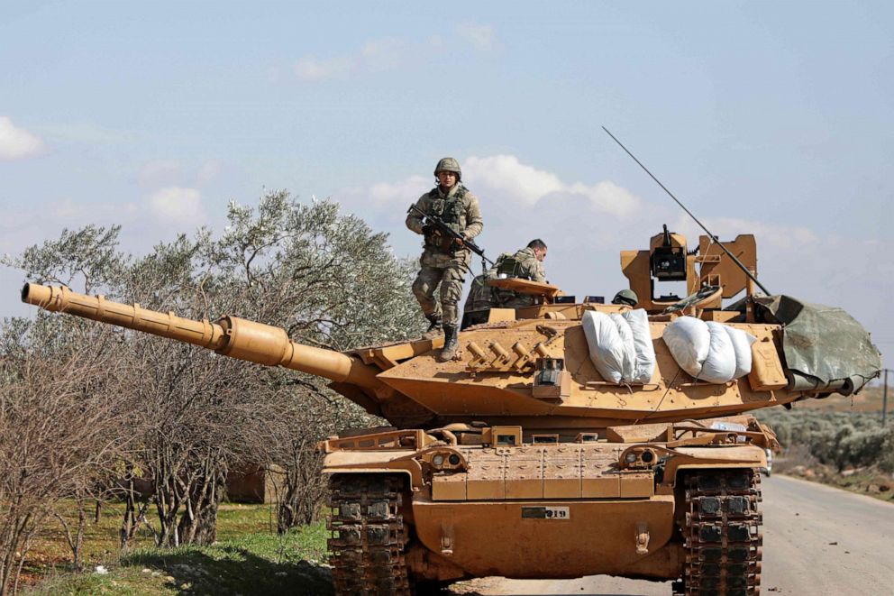 PHOTO: Turkish soldiers stand atop an armored vehicle east of Idlib city in northwestern Syria on Feb. 20, 2020, amid ongoing regime offensive on the last major rebel bastion in the country's northwest.