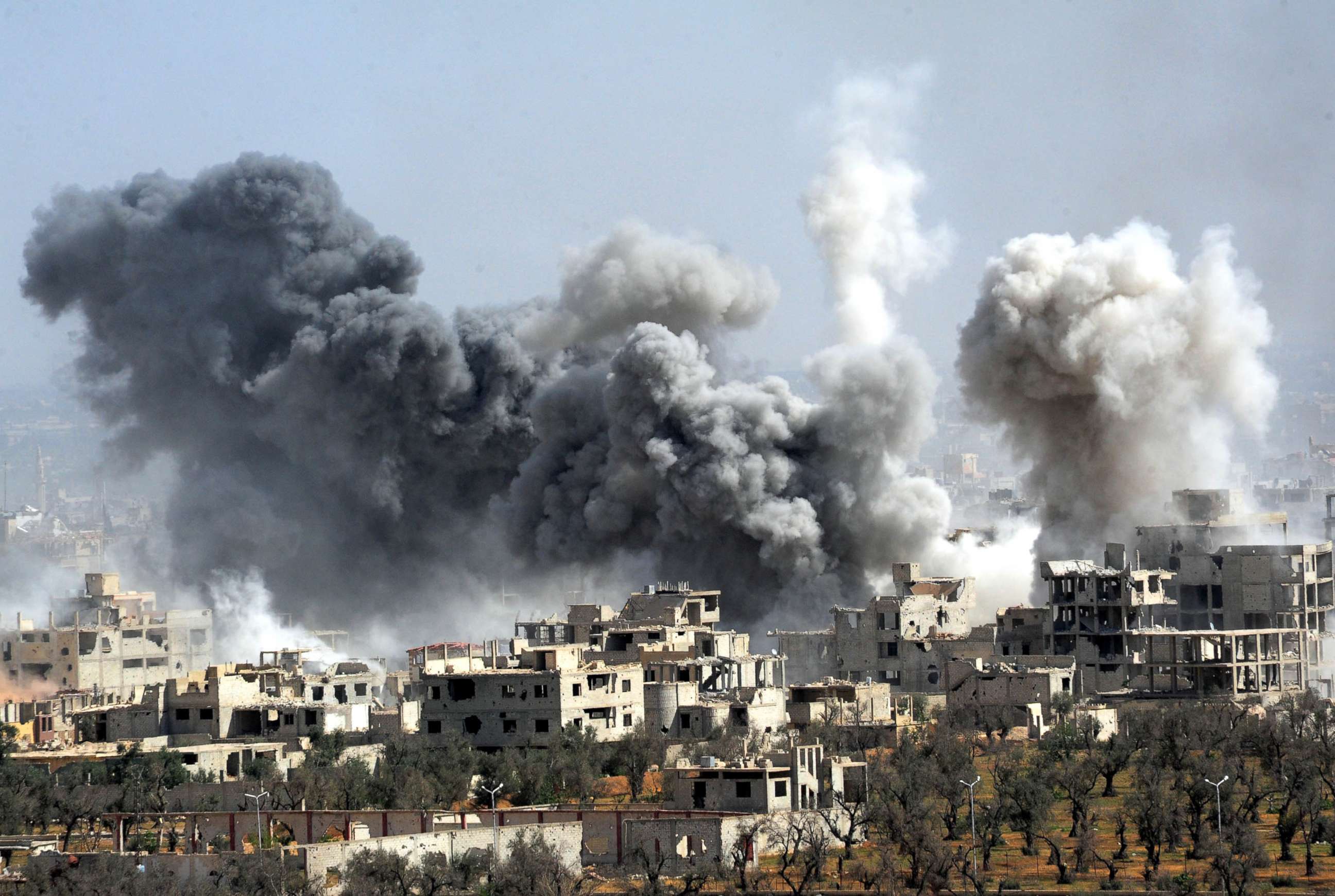 PHOTO: Smoke rises after the Syrian army's shelling targeted the Douma district in Eastern Ghouta countryside of Damascus, Syria, April 7, 2018.