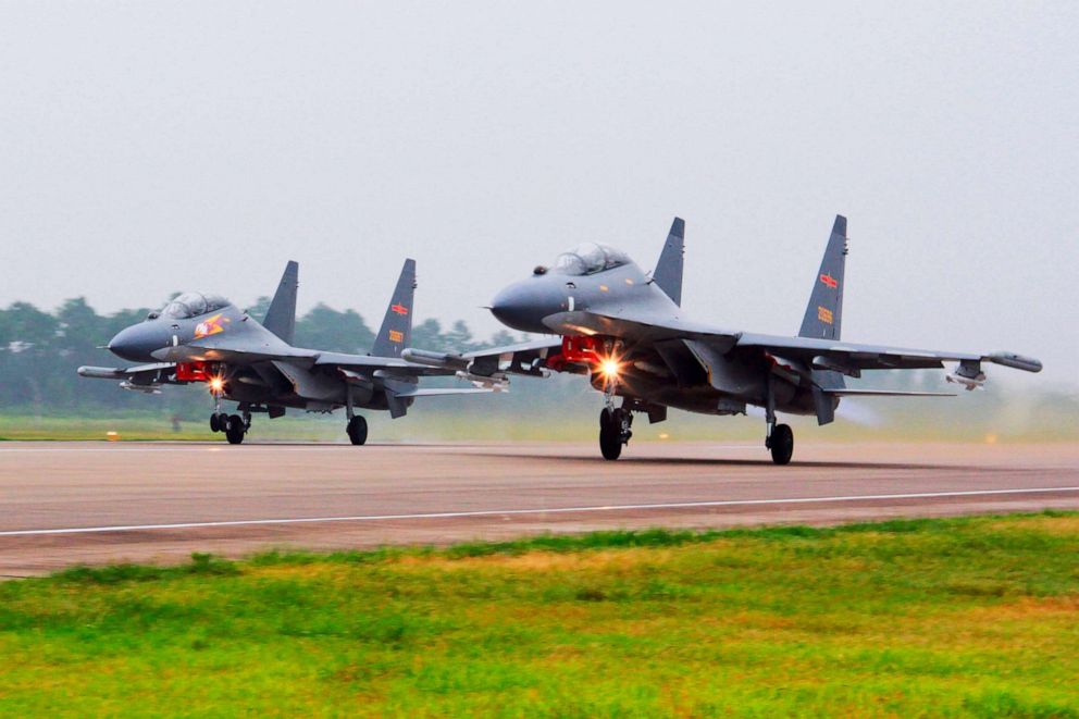 PHOTO: China's Xinhua News Agency released photos of two Chinese SU-30 fighter jets taking off from an unspecified location to fly a patrol over the South China Sea.