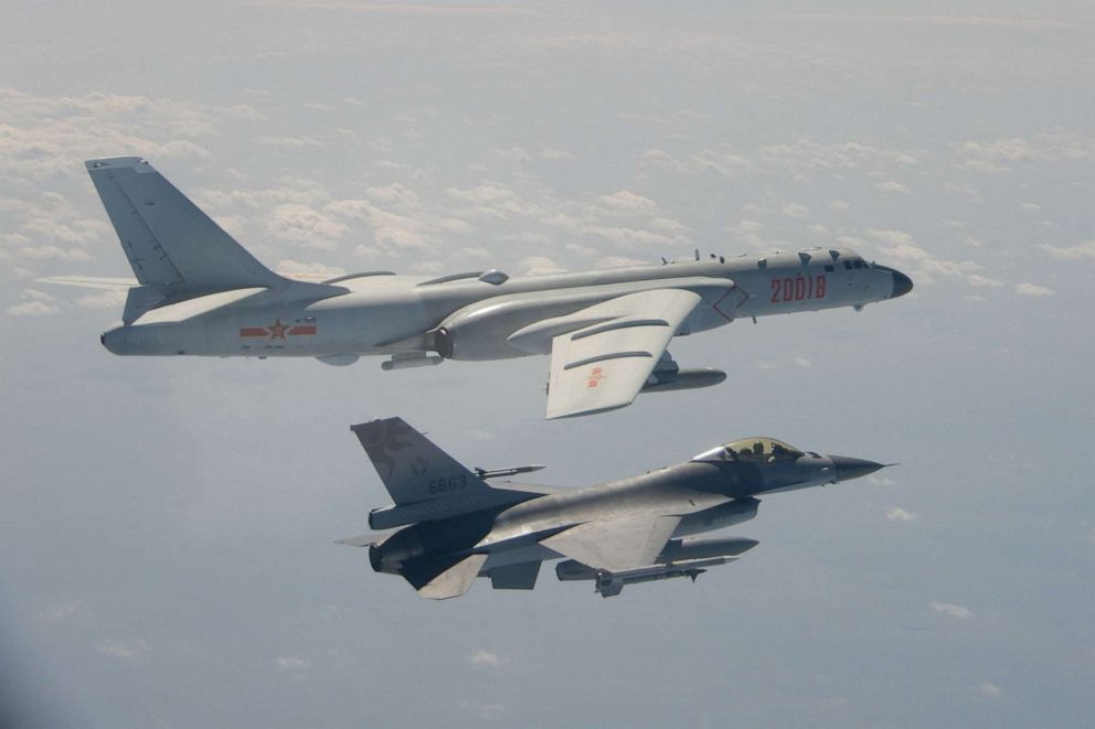 PHOTO: A Taiwanese F-16 fighter jet flying next to a Chinese H-6 bomber (top) off the coast of Taiwan, Feb. 10, 2020. 