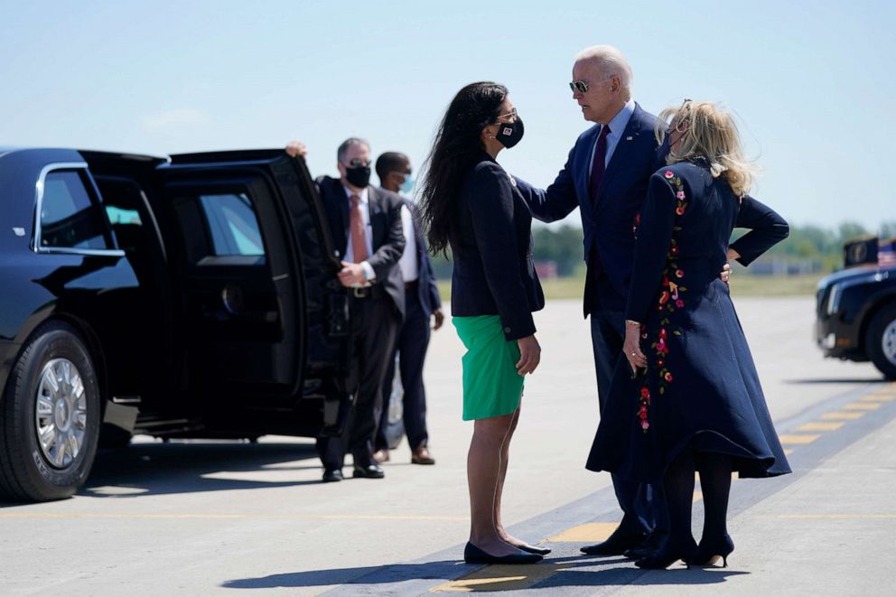 PHOTO: President Joe Biden speaks with Rep. Rashida Tlaib, D-Mich., and Rep. Debbie Dingell, D-Mich, right, as he arrives at Detroit Metropolitan Wayne County Airport in Detroit, May 18, 2021. 