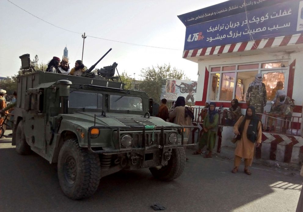 PHOTO: Taliban fighters stand guard at a checkpoint in Kunduz city, northern Afghanistan, Aug. 9, 2021.