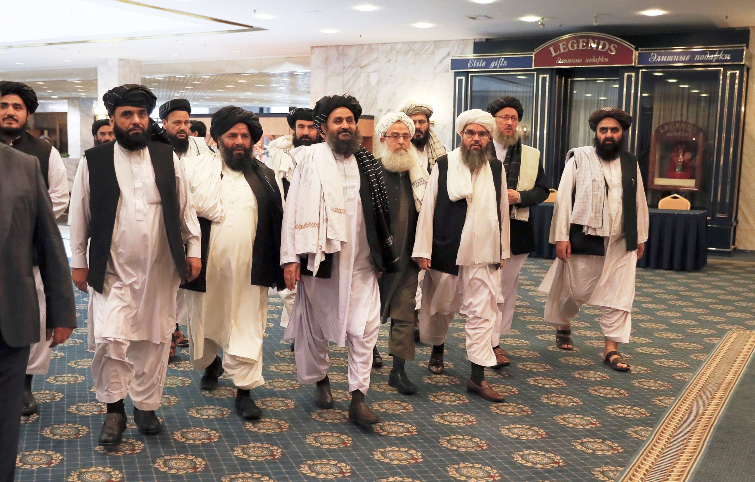 PHOTO: Members of a Taliban delegation, led by chief negotiator Mullah Abdul Ghani Baradar (C, front), walk before a meeting with Afghan senior politicians in Moscow, Russia, May 30, 2019.