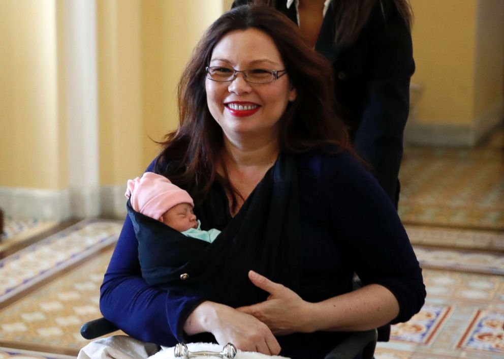 PHOTO: Sen. Tammy Duckworth carries her baby Maile Pearl Bowlsbey after they went to the Senate floor to vote, on Capitol Hill, April 19, 2018 in Washington, D.C.
