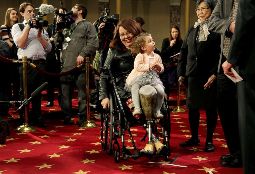 PHOTO: Sen. Tammy Duckworth carries her daughter Abigail in Washington, Jan. 3, 2017.