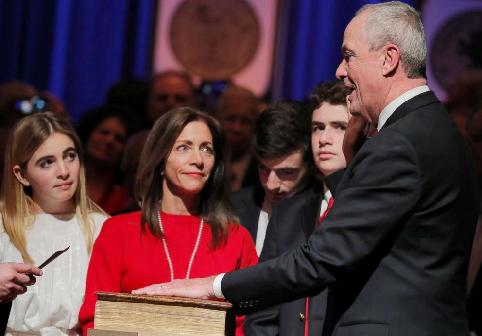 PHOTO: Tammy Murphy, the wife of New Jersey Governor-elect Phil Murphy, looks on as he takes the oath of office in front of his family in Trenton, N.J., Jan. 16, 2018.
