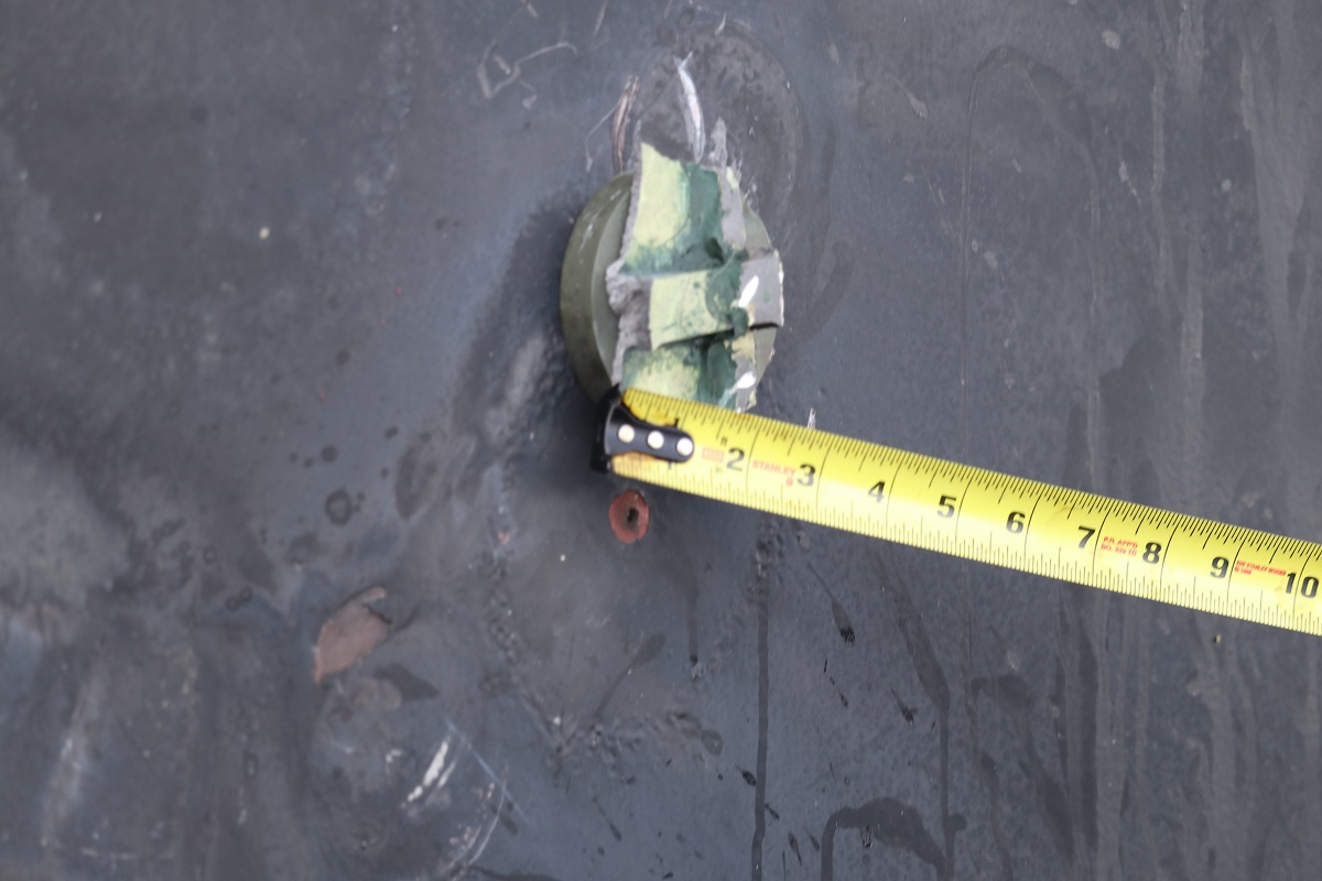 PHOTO: This photo depicts the aluminum and green composite material left behind following removal of an unexploded limpet mine used in an attack on the starboard side of motor vessel M/T Kokuka Courageous, while operating in the Gulf of Oman, June 13th.