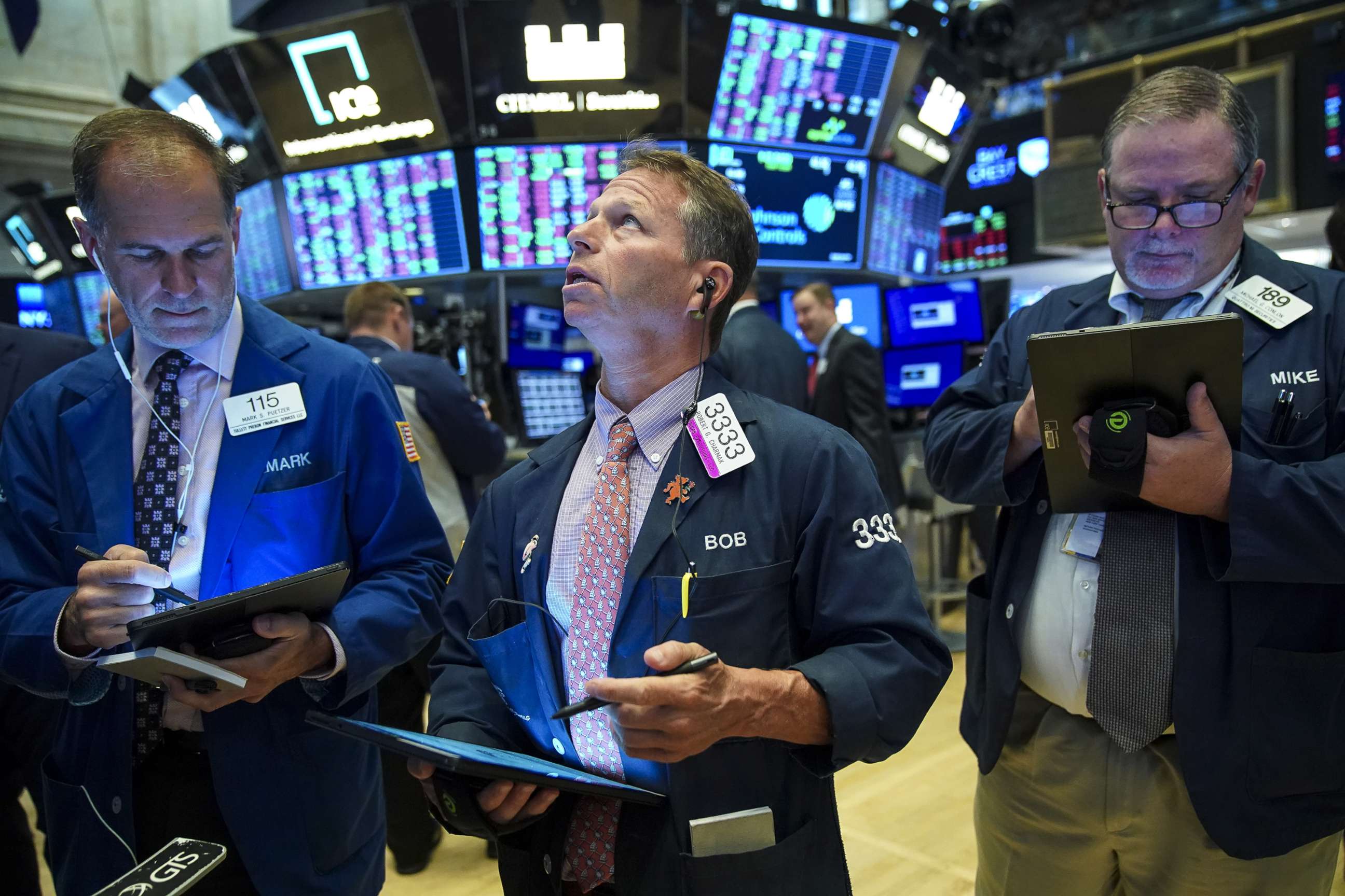 PHOTO: Traders and financial professionals work on the floor of the New York Stock Exchange (NYSE) at the opening bell on August 13, 2019, in New York.