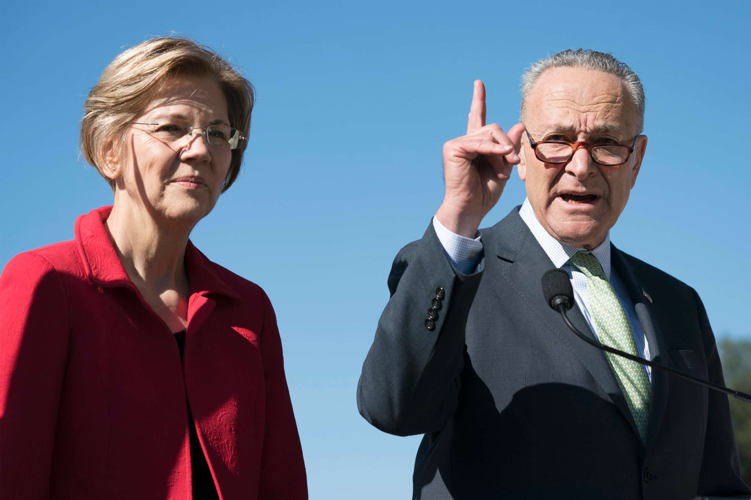PHOTO: Senate Minority Leader Democrat Chuck Schumer speaks on Republican-crafted tax plans, beside Elizabeth Warren during a news conference on Capitol Hill in Washington, DC, Oct. 18, 2017. 