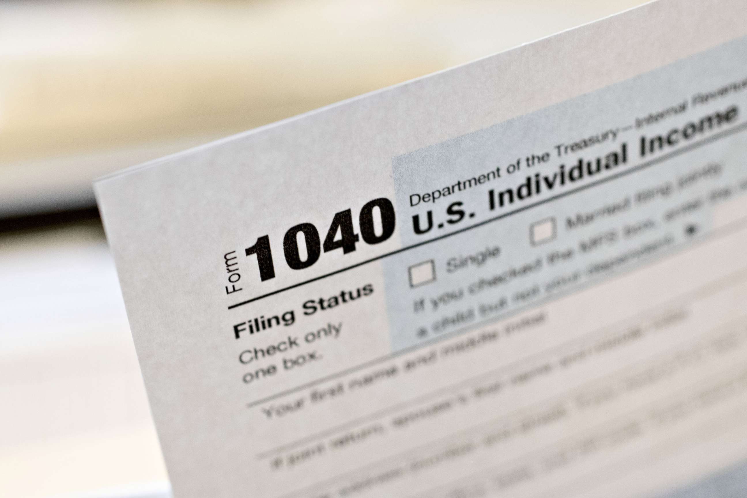 PHOTO: A U.S. Department of the Treasury Internal Revenue Service (IRS) 1040 Individual Income Tax form for the 2019 tax year is arranged for a photograph in Tiskilwa, Ill., March 20, 2020. 