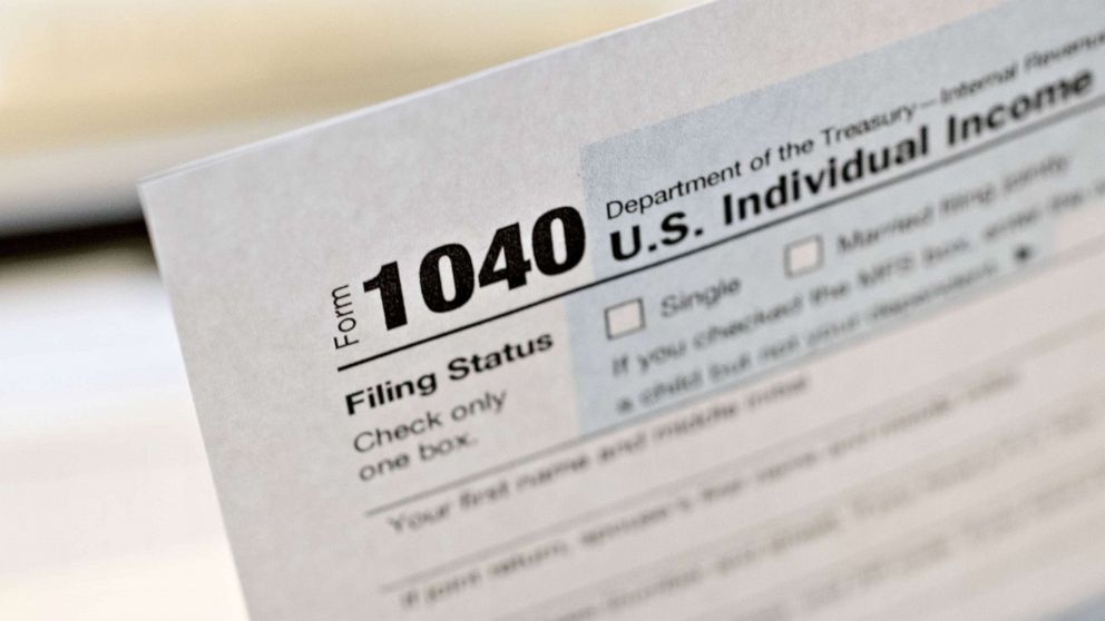 PHOTO: A U.S. Department of the Treasury Internal Revenue Service (IRS) 1040 Individual Income Tax form for the 2019 tax year is arranged for a photograph in Tiskilwa, Ill., March 20, 2020. 