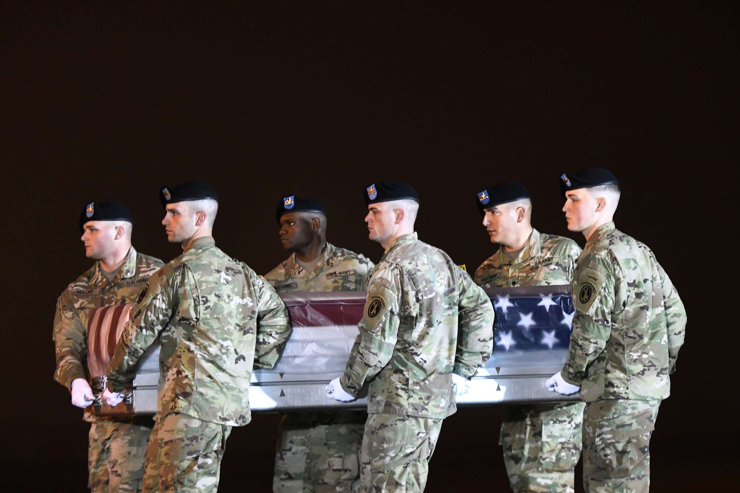 PHOTO: An Army carry team moves a transfer case containing the remains of Maj. Brent R. Taylor at Dover Air Force Base, Del., Nov. 6, 2018.