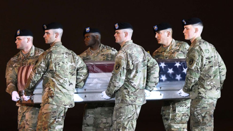 PHOTO: An Army carry team moves a transfer case containing the remains of Maj. Brent R. Taylor at Dover Air Force Base, Del., Nov. 6, 2018.