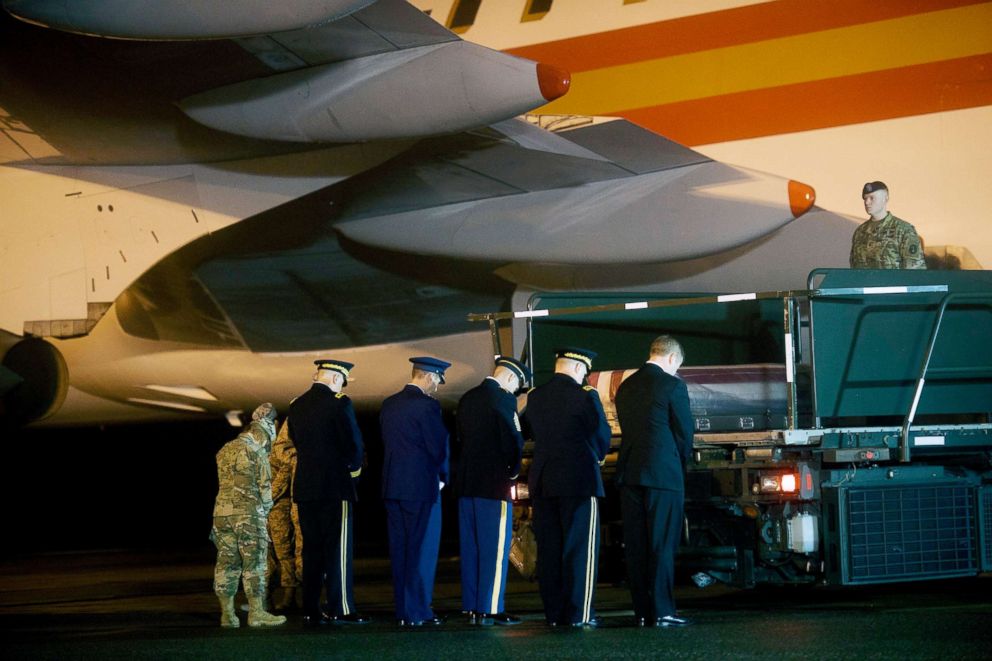 PHOTO: Armed forces pray beside the transfer case for fallen service member, Major Brent R. Taylor, during a dignified transfer at Dover Air Force Base, Nov. 6, 2018, in Dover, Del.