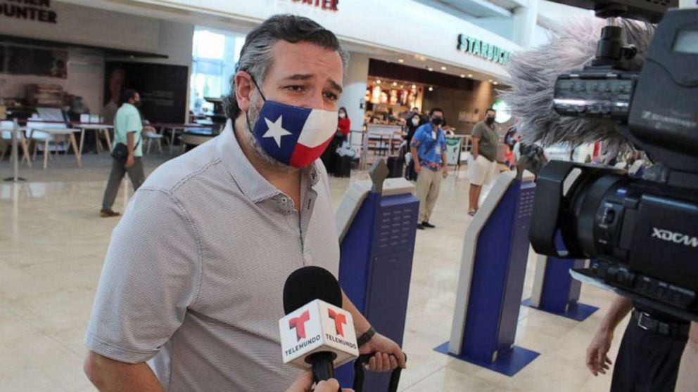 PHOTO: Sen. Ted Cruz speaks to the media at the Cancun International Airport before boarding his plane back to the U.S., Feb. 18, 2021, in Cancun, Mexico.