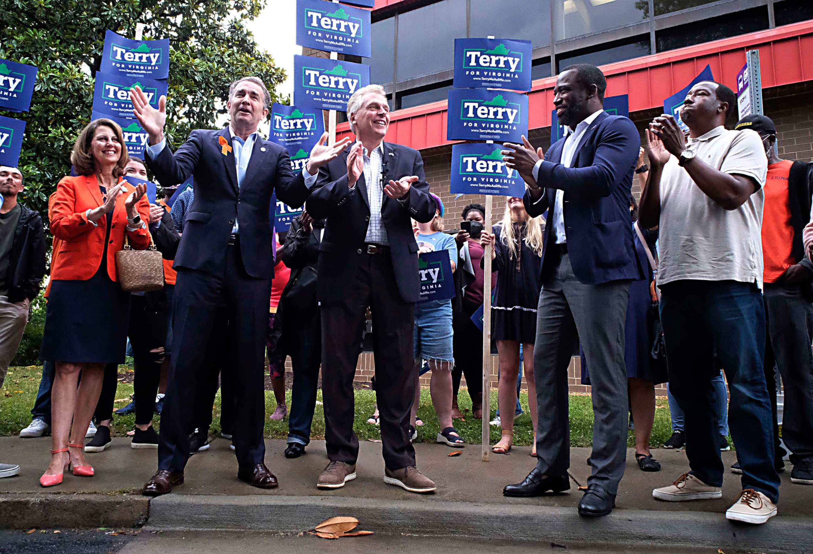 PHOTO: Virginia Governor Ralph Northam, second from left, talks about his  endorsement in the Democratic gubernatorial primary of former governor Terry McAuliffe, third  from left, during a quick rally in Richmond, Va., June 4, 2021. 