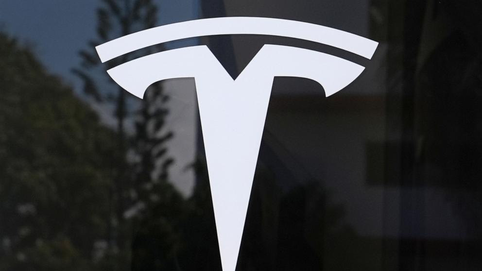 PHOTO: The Tesla logo is displayed at a Tesla dealership, Mar. 13, 2025, in Miami.