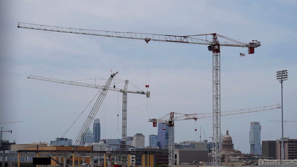 PHOTO: Construction cranes hover over downtown and near the State Capitol, April 26, 2021, in Austin, Texas. 