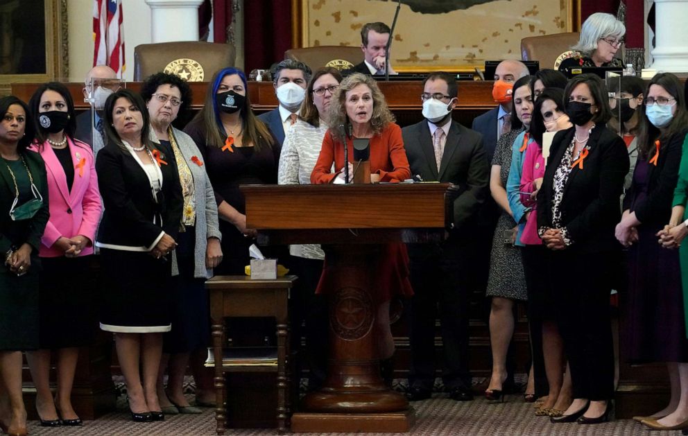 PHOTO: Texas state Rep. Donna Howard, D-Austin, center at lectern, stands with fellow lawmakers in the House Chamber, May 5, 2021, in Austin, Texas, as she opposes a bill introduced that would ban abortions as early as six weeks.