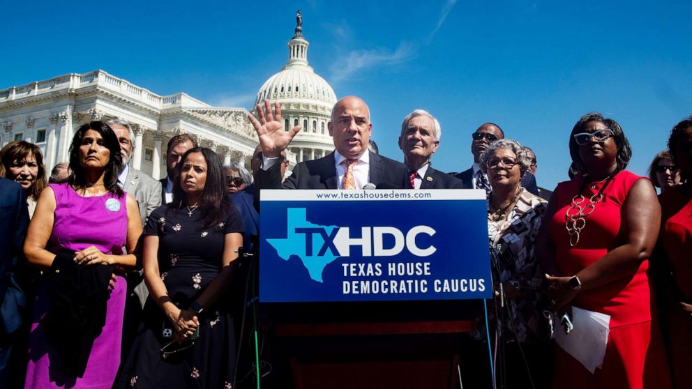 PHOTO: Chair of the Texas House Democratic Caucus Chris Turner, center, speaks at a news conference held by Democratic members of the Texas state legislature, outside the United States House of Representatives on Capitol Hill in Washington, July 13, 2021.