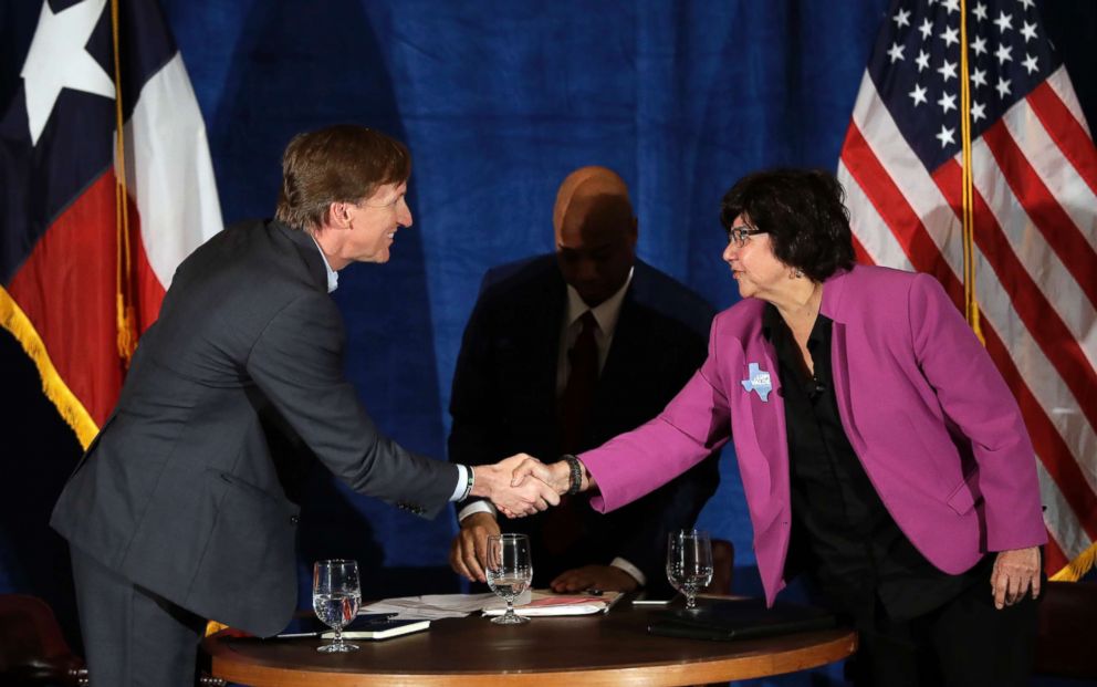 PHOTO: Texas Democratic gubernatorial candidates Andrew White, left, and Lupe Valdez, right, shake hands following their debate, May 11, 2018, in Austin, Texas.