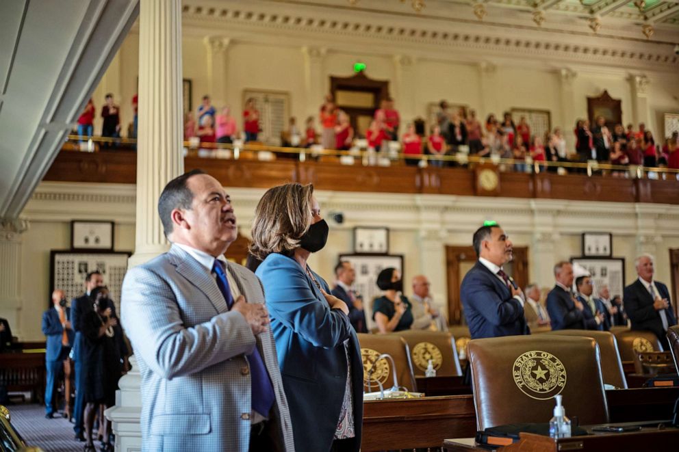 PHOTO: Texas state representatives recite the pledge of allegiance in the House chamber at the start of the 87th Legislature's third special session at the State Capitol on Sept. 20, 2021 in Austin, Texas. 